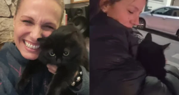 Denise Dumas abrazando a su gata Mina tras el rescate