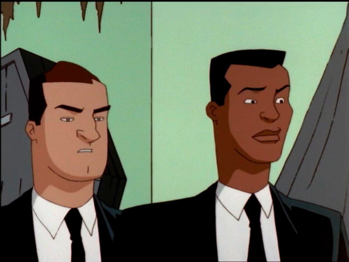 Personajes de la serie animada Men in Black con trajes oscuros